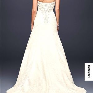 A line lace wedding dress with side split detail. Size 22